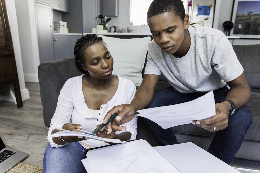 Beautiful couple working on their finances together.