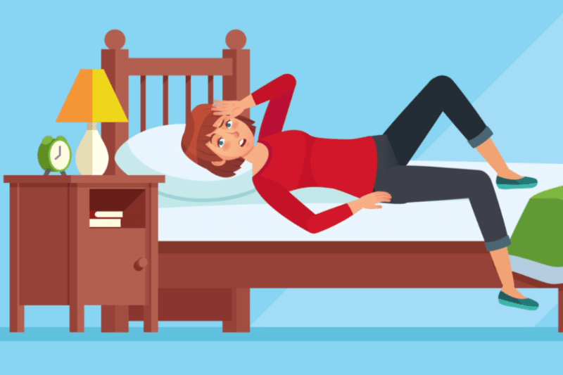 Video - How Can I Make My Home More Comfortable? Image is an animated illustration of a woman wearing jeans and a red long-sleeved shirt while laying above the covers on a brown, wooden bed. The background is light blue.